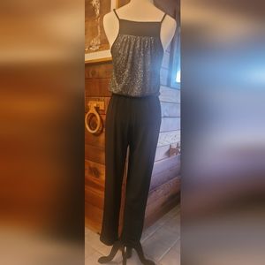 A glitter topped black jumpsuit